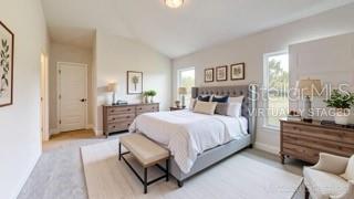 1827 Roberts Trail Bell, FL 32619 - Photo 11 of 28 a spacious bedroom with a bed and a dresser