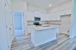 1827 Roberts Trail Bell, FL 32619 - Photo 14 of 28 a kitchen with a sink cabinets and wooden floor