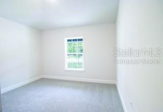 1827 Roberts Trail Bell, FL 32619 - Photo 22 of 28 an empty room with a window