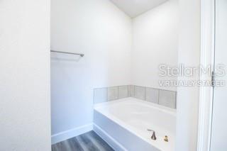1827 Roberts Trail Bell, FL 32619 - Photo 26 of 28 a white bath tub sitting in a bathroom