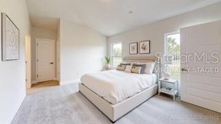 1827 Roberts Trail Bell, FL 32619 - Photo 9 of 28 a bed room with a bed and a night stand