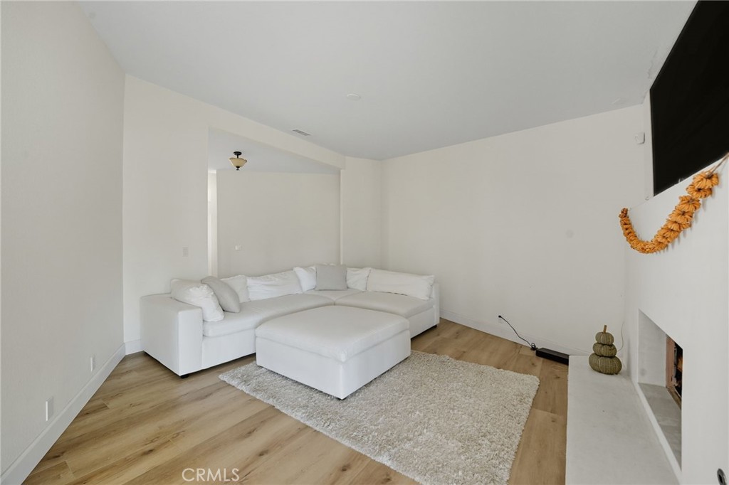15901 Viewpoint Road Riverside, CA 92504 - Photo 15 of 46 a living room with furniture and a flat screen tv