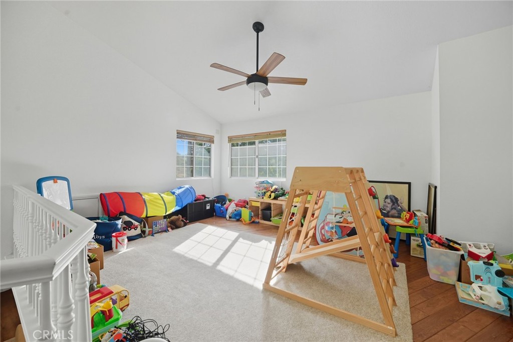 15901 Viewpoint Road Riverside, CA 92504 - Photo 19 of 46 a bedroom with furniture and a gym equipment