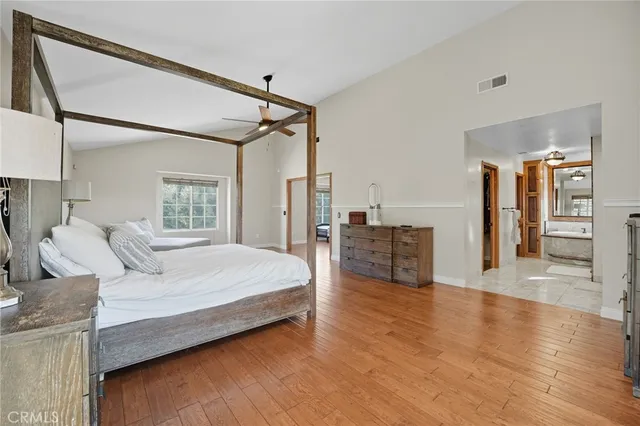 a bathroom with a double vanity sink a mirror and a shower