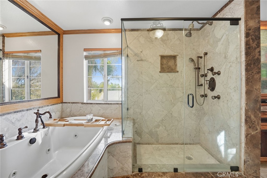 15901 Viewpoint Road Riverside, CA 92504 - Photo 25 of 46 a bathroom with a bath tub a sink and shower