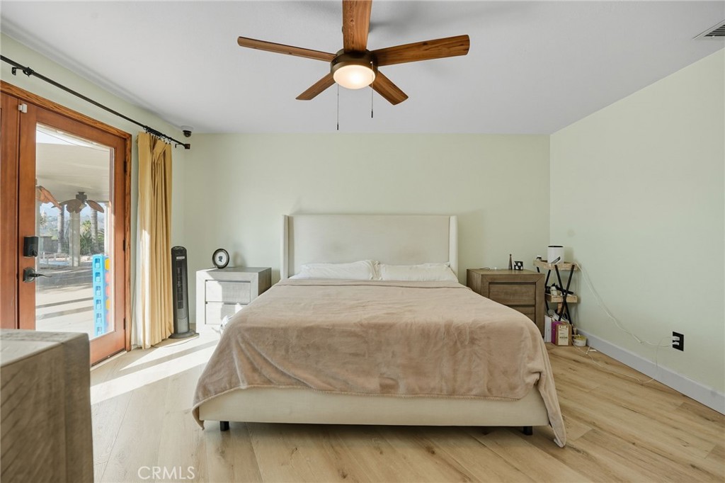 15901 Viewpoint Road Riverside, CA 92504 - Photo 30 of 46 a bedroom with a bed and window