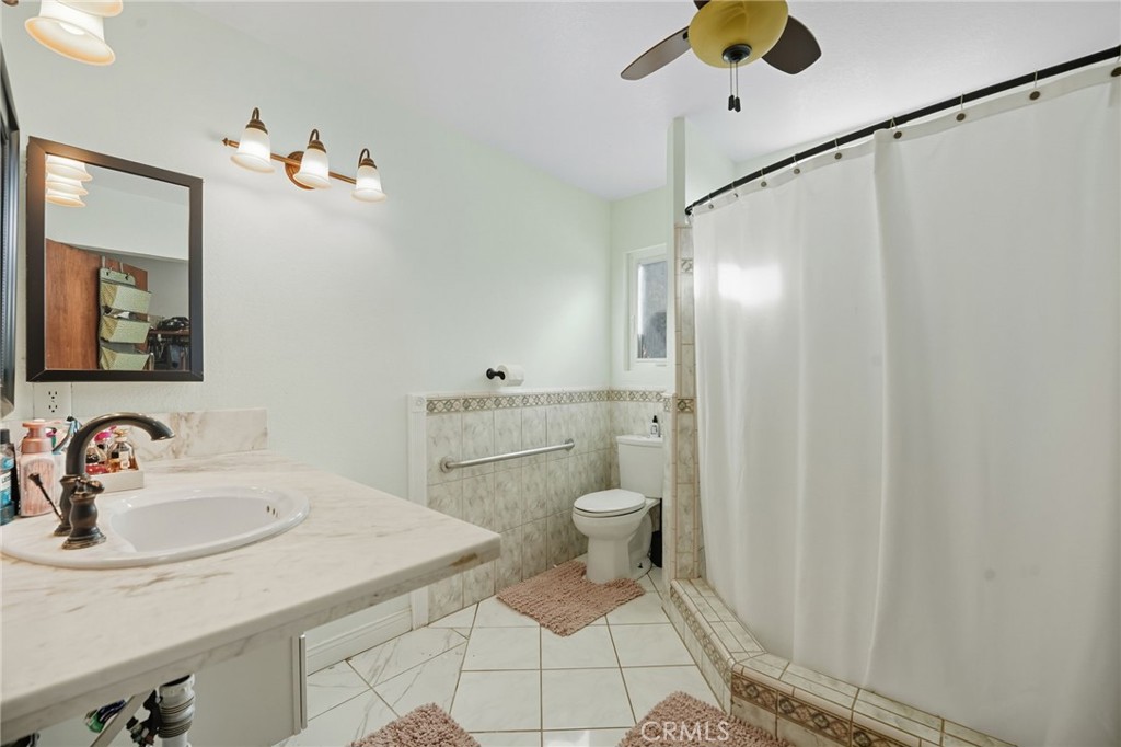 15901 Viewpoint Road Riverside, CA 92504 - Photo 32 of 46 a bathroom with a sink toilet and shower
