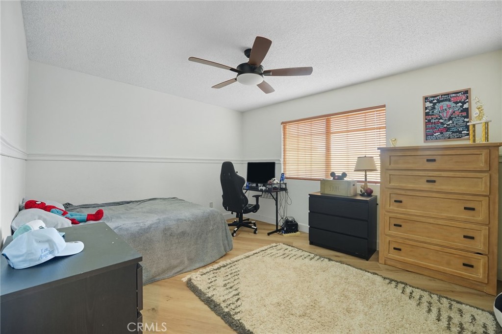 15901 Viewpoint Road Riverside, CA 92504 - Photo 35 of 46 a bed room with a bed and a window