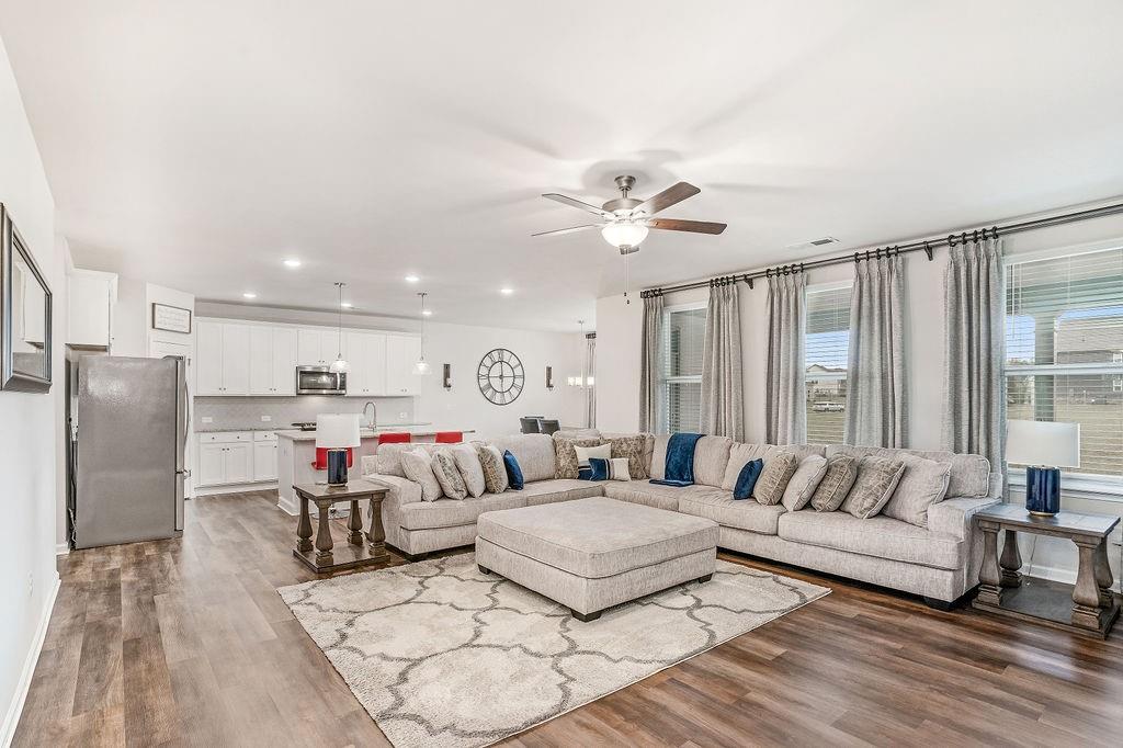 112 Leveret Road Locust Grove, GA 30248 - Photo 11 of 47 a living room with furniture and a large window