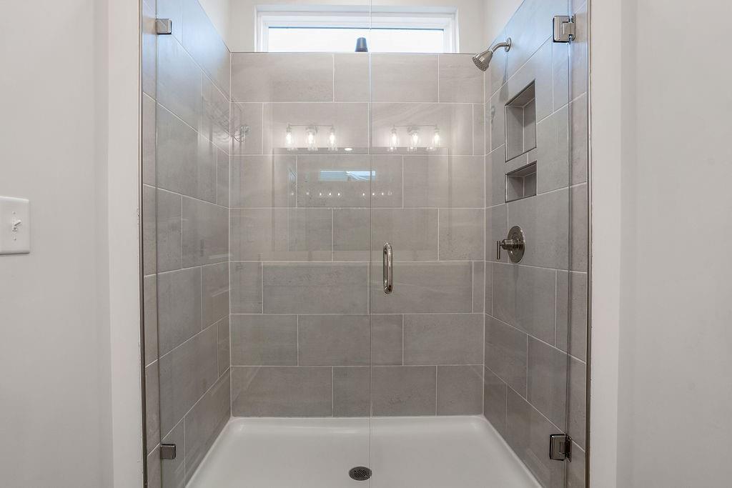 112 Leveret Road Locust Grove, GA 30248 - Photo 26 of 47 a bathroom with a shower