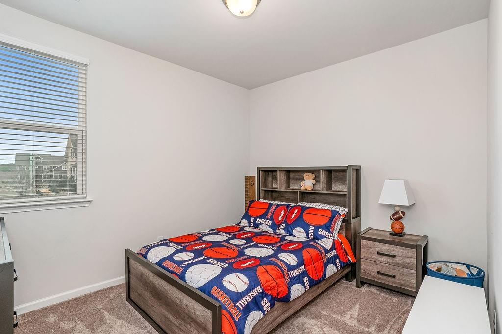 112 Leveret Road Locust Grove, GA 30248 - Photo 31 of 47 a bedroom with a bed and window