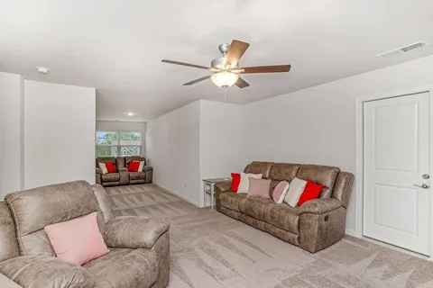 a living room with furniture and a couch