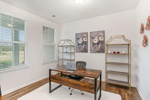 a workspace with furniture and window