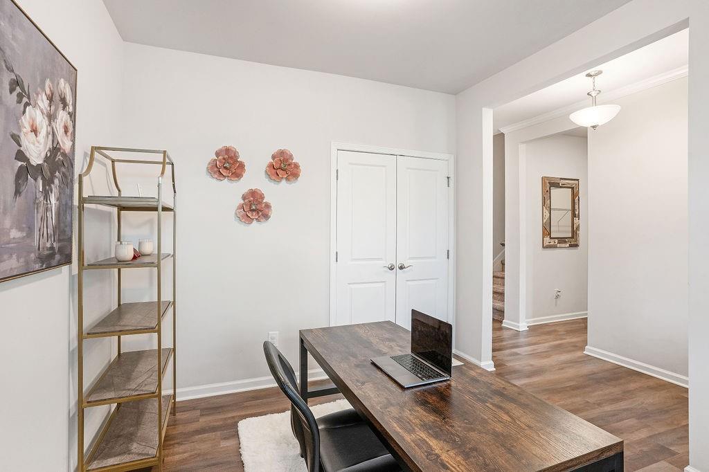 112 Leveret Road Locust Grove, GA 30248 - Photo 6 of 47 a view of a workspace with furniture and wooden floor