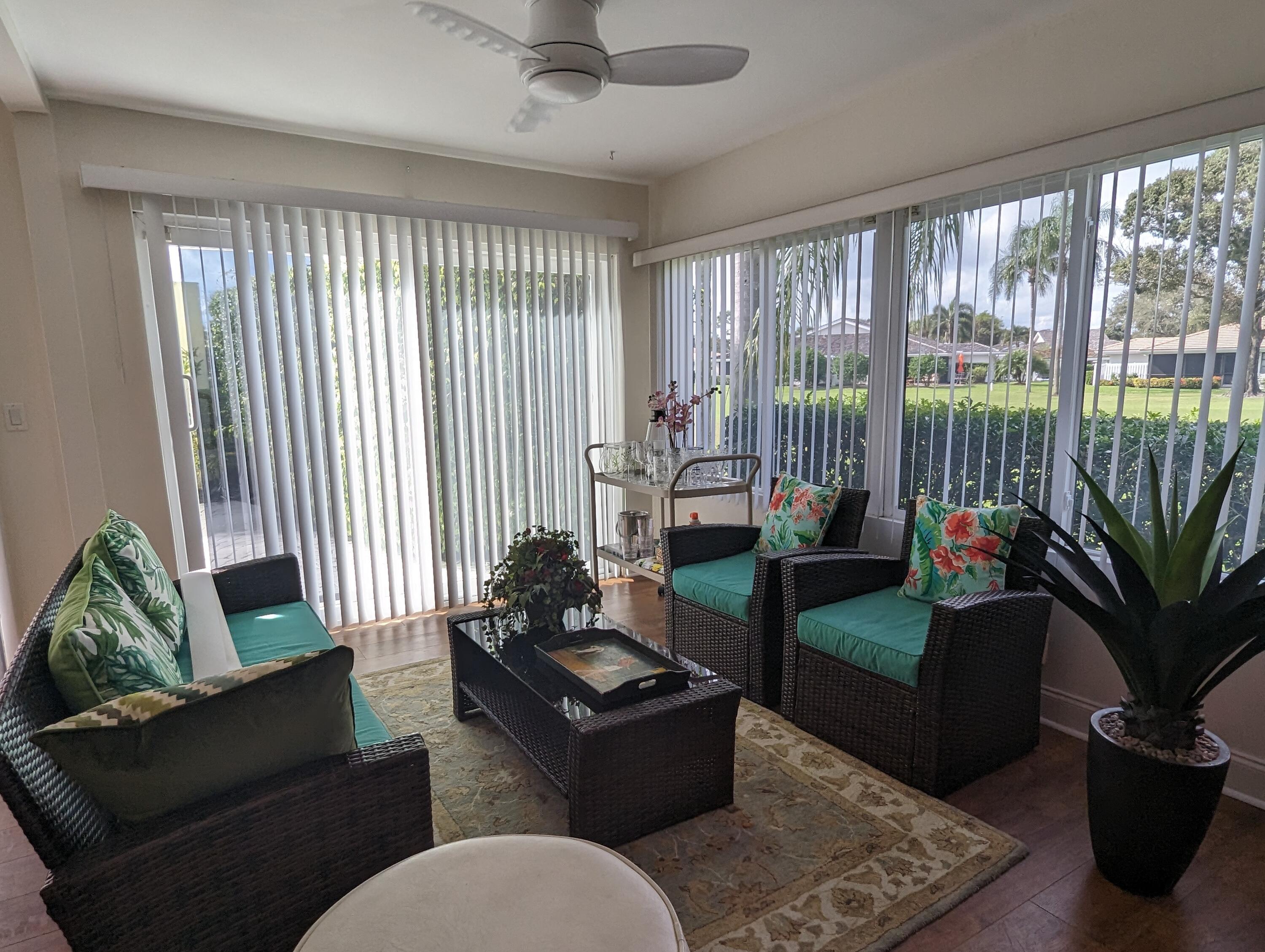 17042 Traverse Circle Jupiter, FL 33477 - Photo 7 of 30 a living room with furniture and a floor to ceiling window