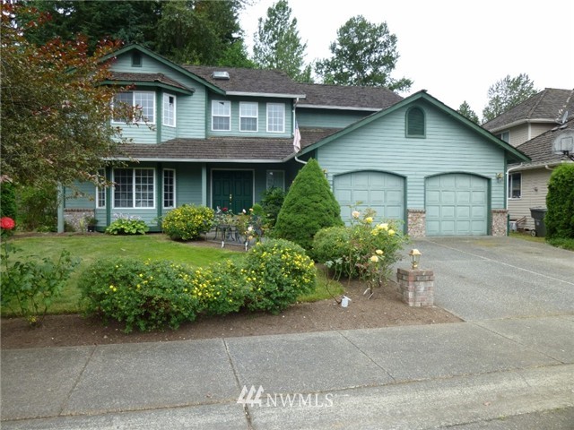 23116 14th Drive Southeast Bothell, WA 98021 - Photo 1 of 1 a front view of a house with a garden