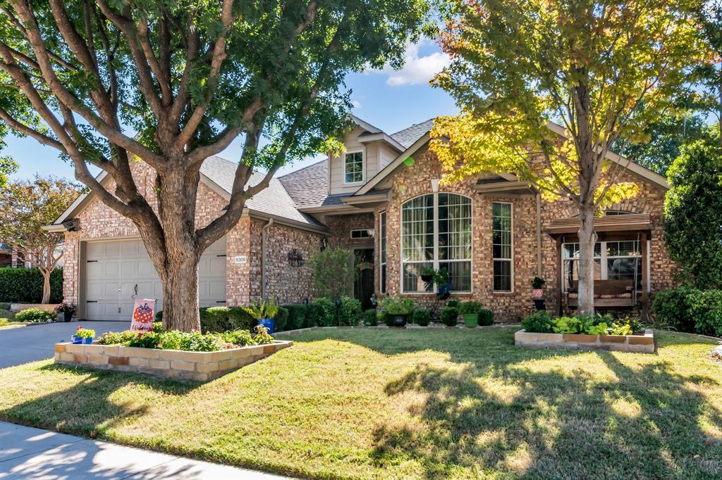 5308 Elmdale Drive Watauga, TX 76137 - Photo 1 of 1 a front view of a house with yard and green space