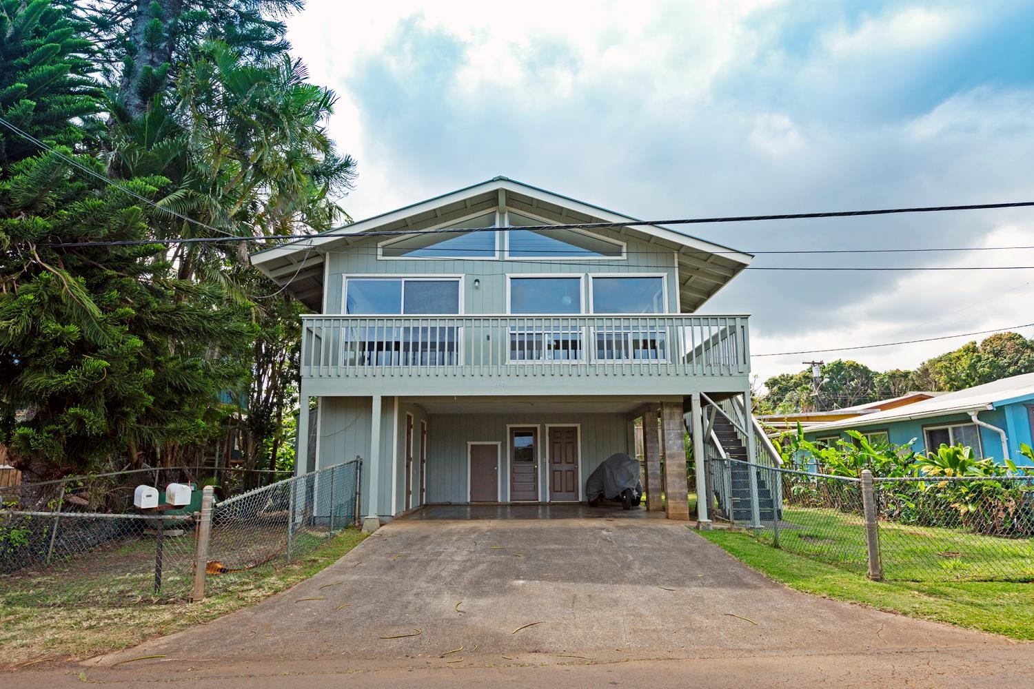 974 Haiku Road Haiku, HI 96708 - Photo 1 of 27 a front view of a house with a porch