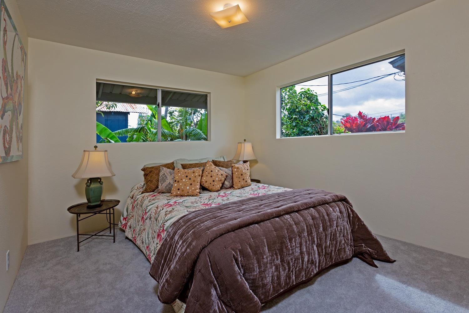 974 Haiku Road Haiku, HI 96708 - Photo 11 of 27 a bed sitting in a bedroom next to a window