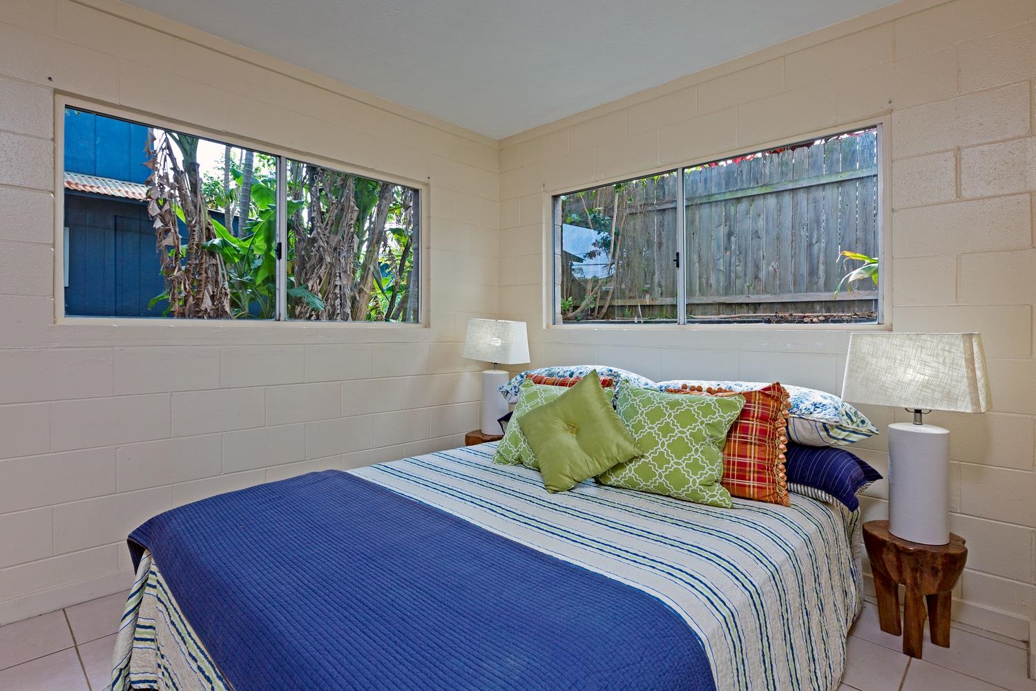 974 Haiku Road Haiku, HI 96708 - Photo 19 of 27 a bedroom with a bed and a window