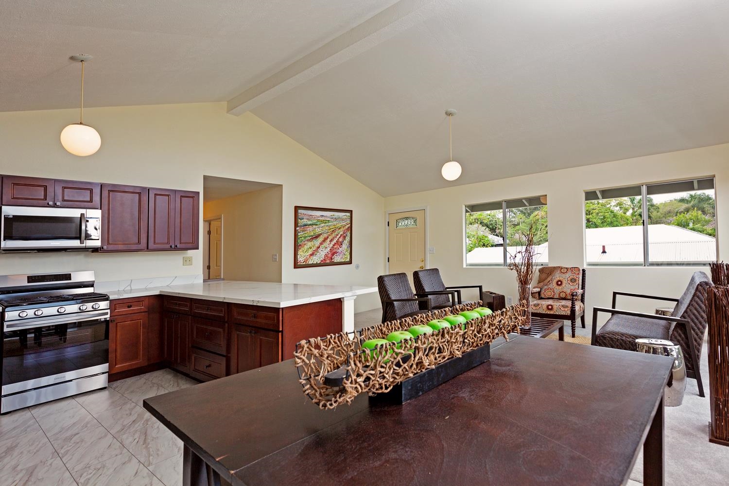 974 Haiku Road Haiku, HI 96708 - Photo 3 of 27 a living room with furniture kitchen view and large windows