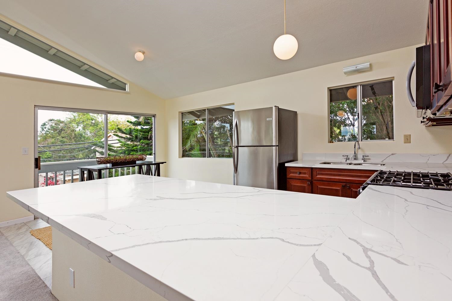 974 Haiku Road Haiku, HI 96708 - Photo 6 of 27 a kitchen with stainless steel appliances a refrigerator and a counter top space