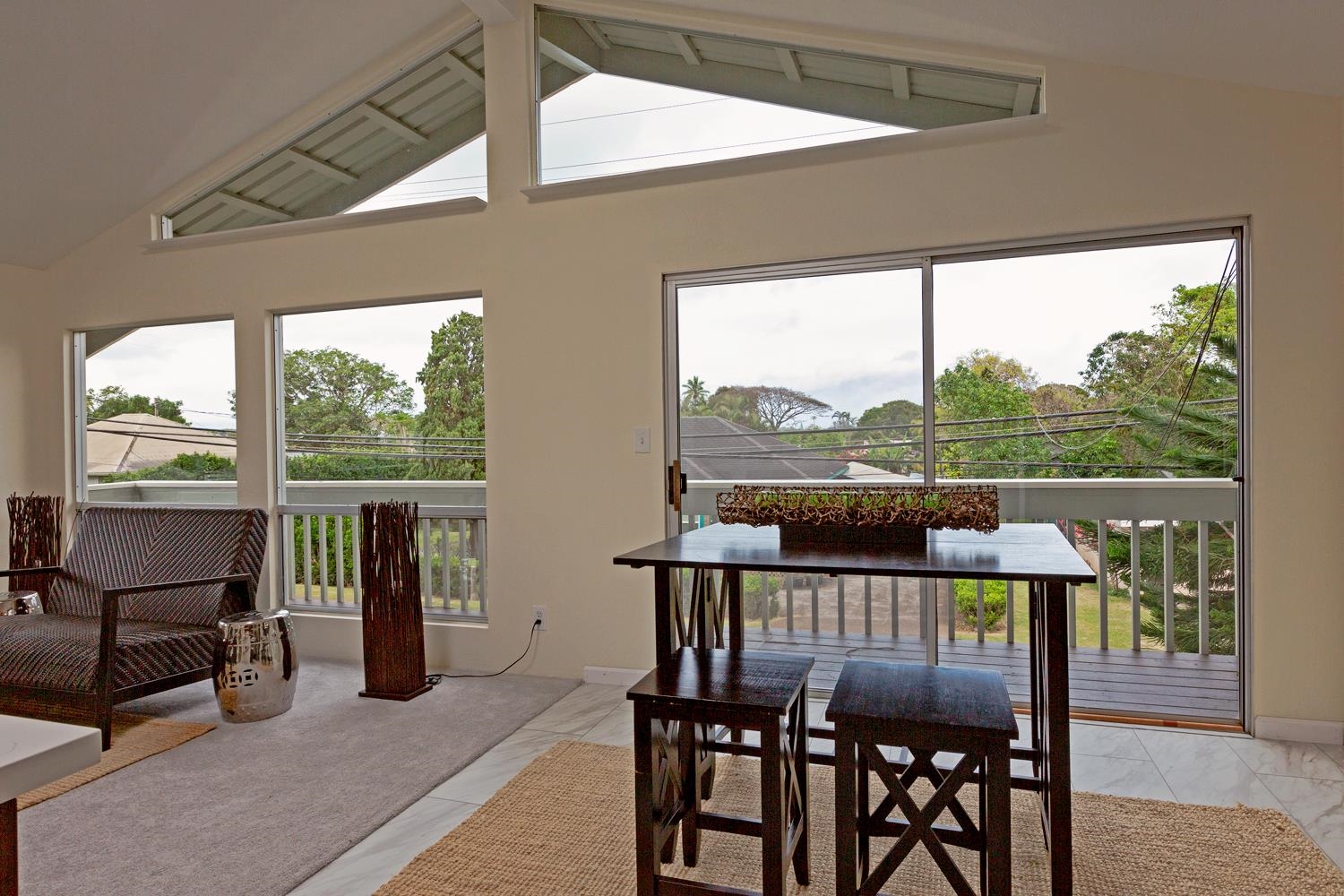 974 Haiku Road Haiku, HI 96708 - Photo 8 of 27 a view of a city from a balcony with furniture
