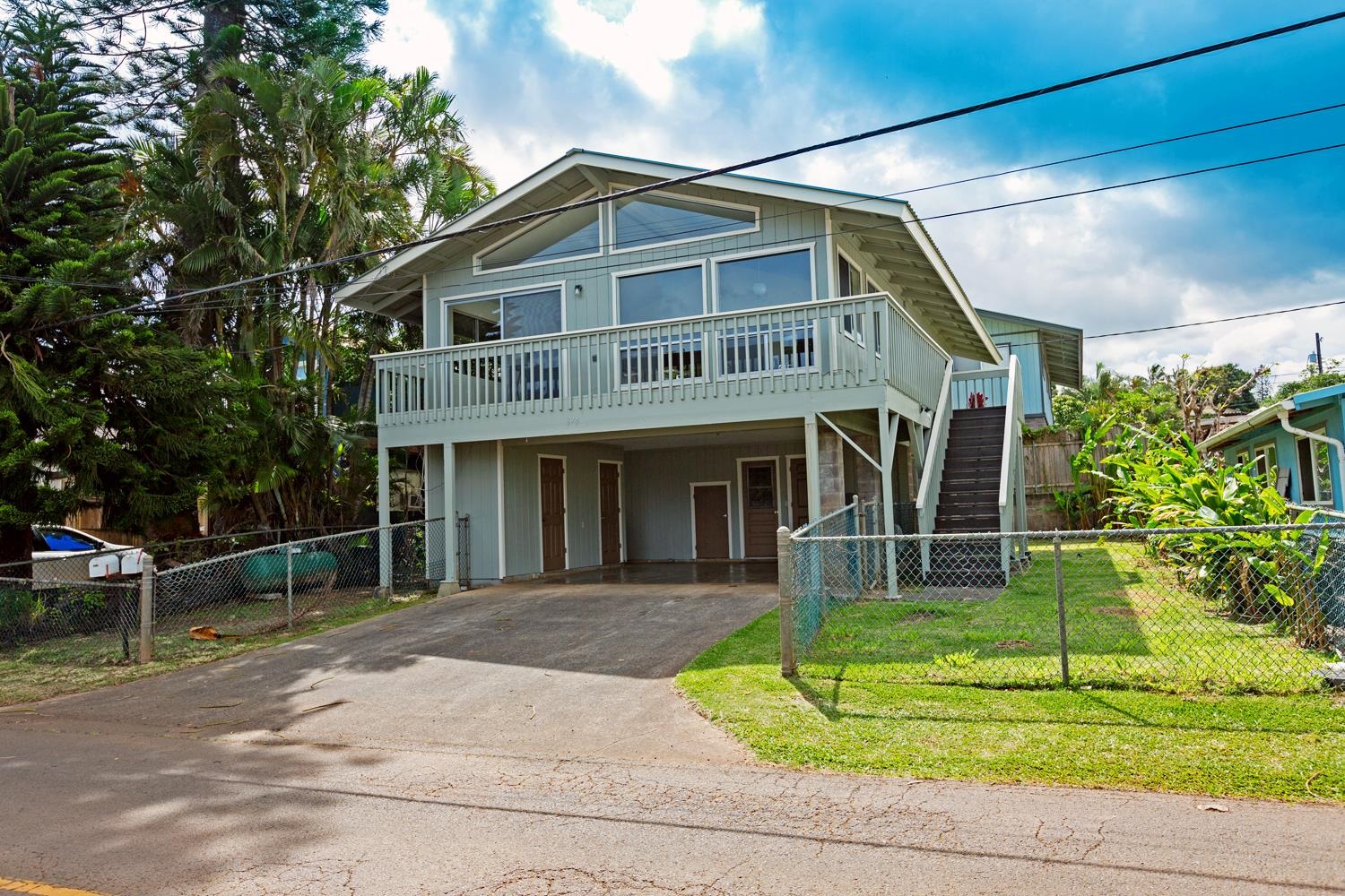 974 Haiku Road Haiku, HI 96708 - Photo 10 of 27 a front view of a house with a yard