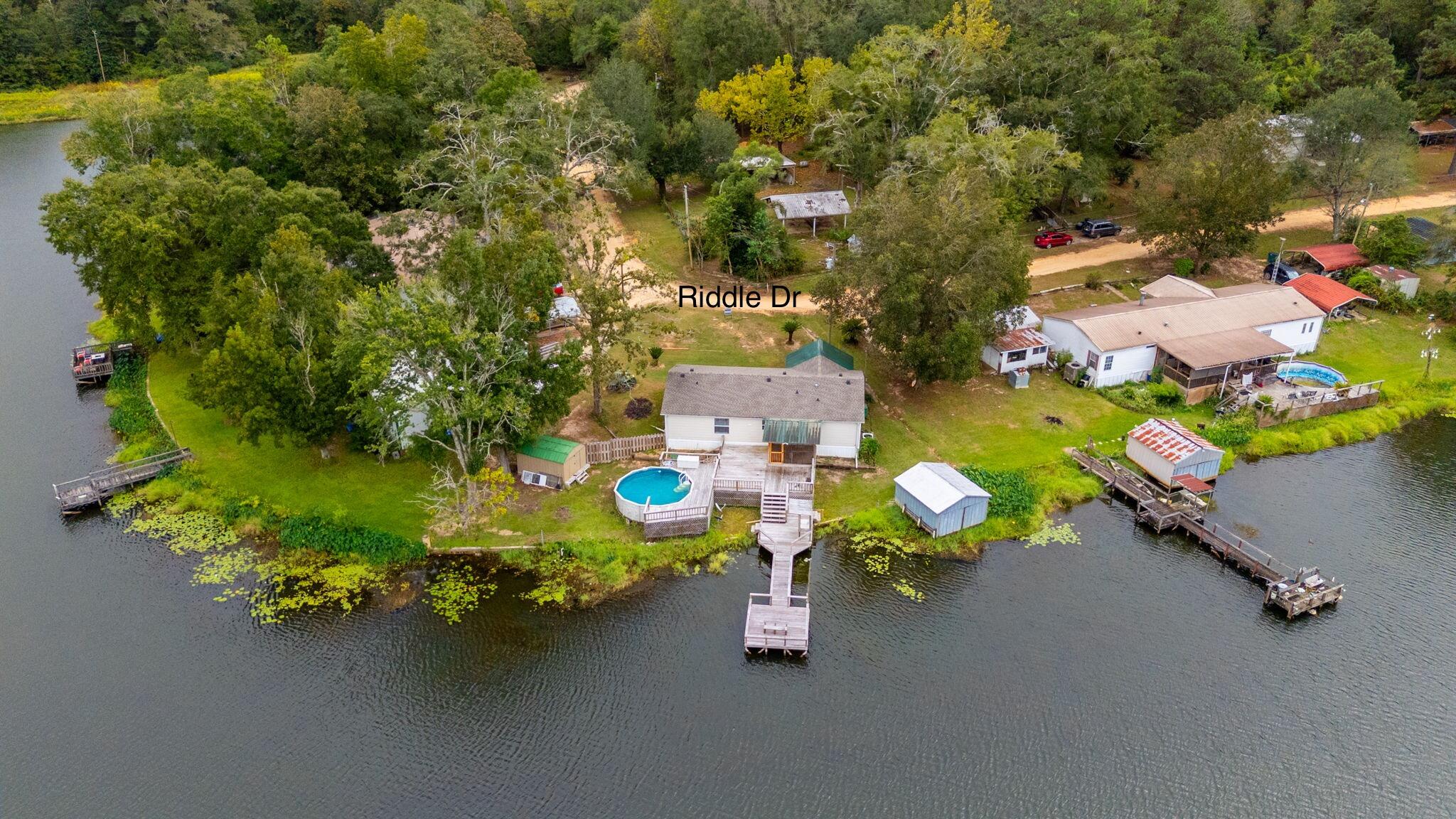1314 Riddle Drive Westville, FL 32464 - Photo 3 of 35 an aerial view of a house with swimming pool and outdoor seating