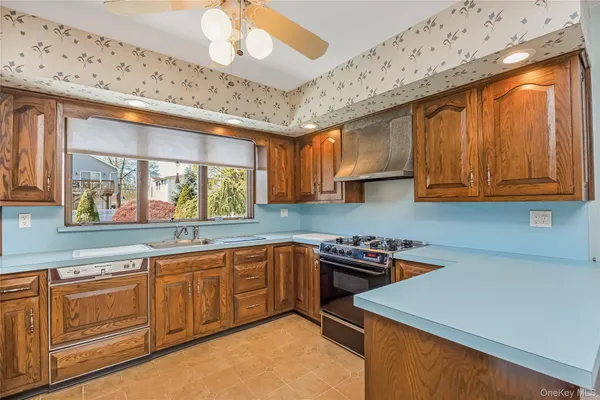 a kitchen with sink cabinets and window