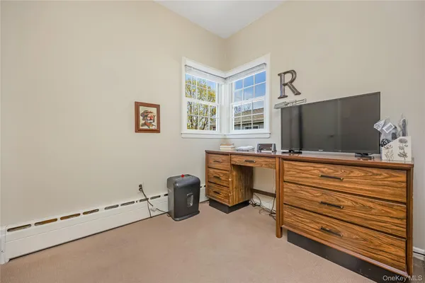 a room with furniture and a flat screen tv