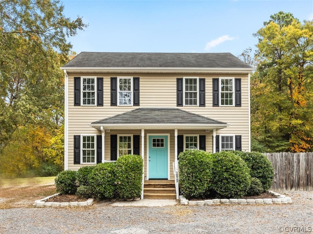 front view of brick house with a yard