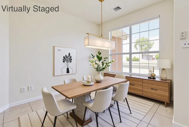 a dining room with furniture and window