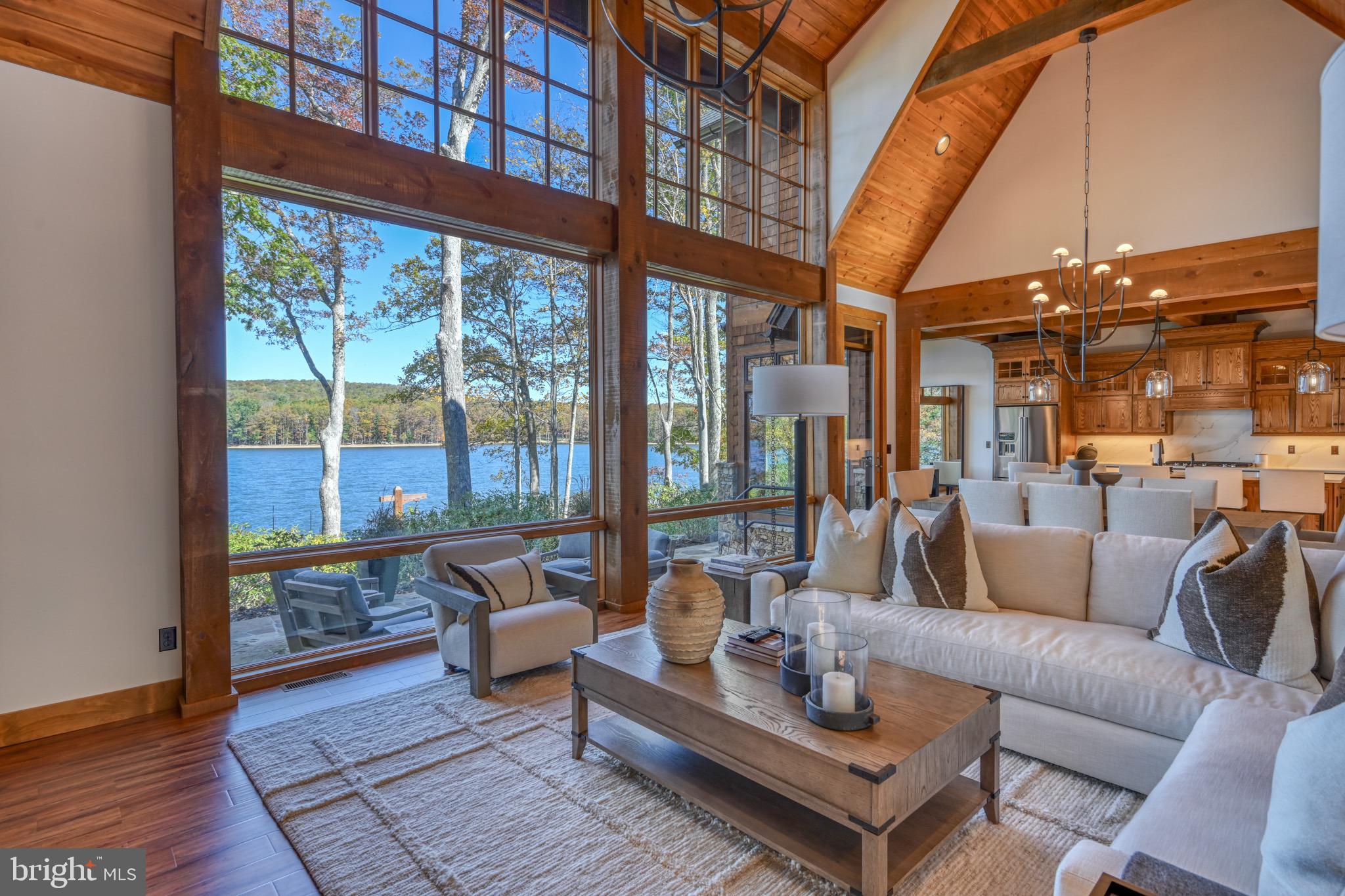 3135 Turkey Neck Road Swanton, MD 21561 - Photo 12 of 74 a living room with furniture and a floor to ceiling window