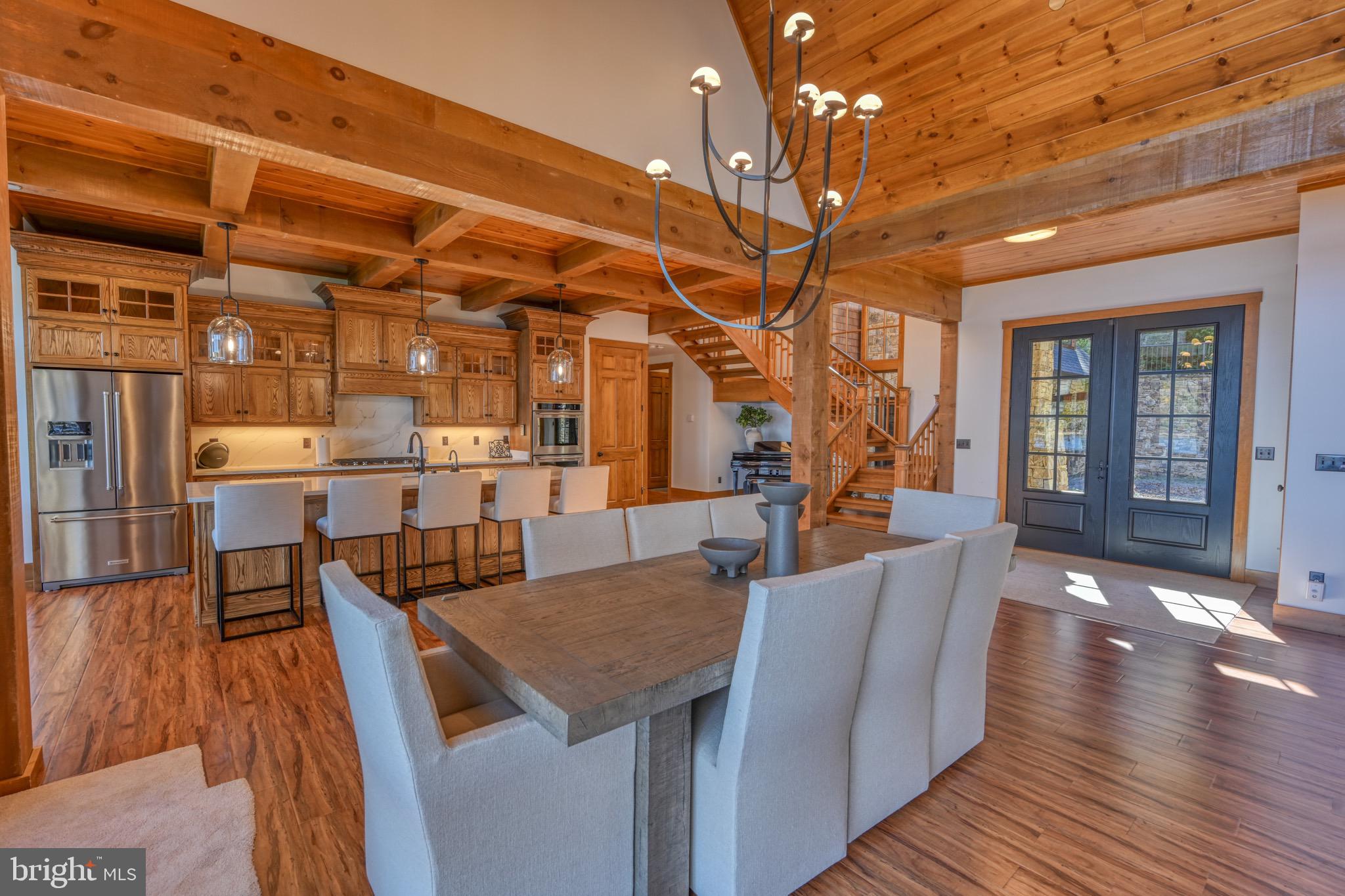 3135 Turkey Neck Road Swanton, MD 21561 - Photo 14 of 74 a view of a dining room with furniture and wooden floor