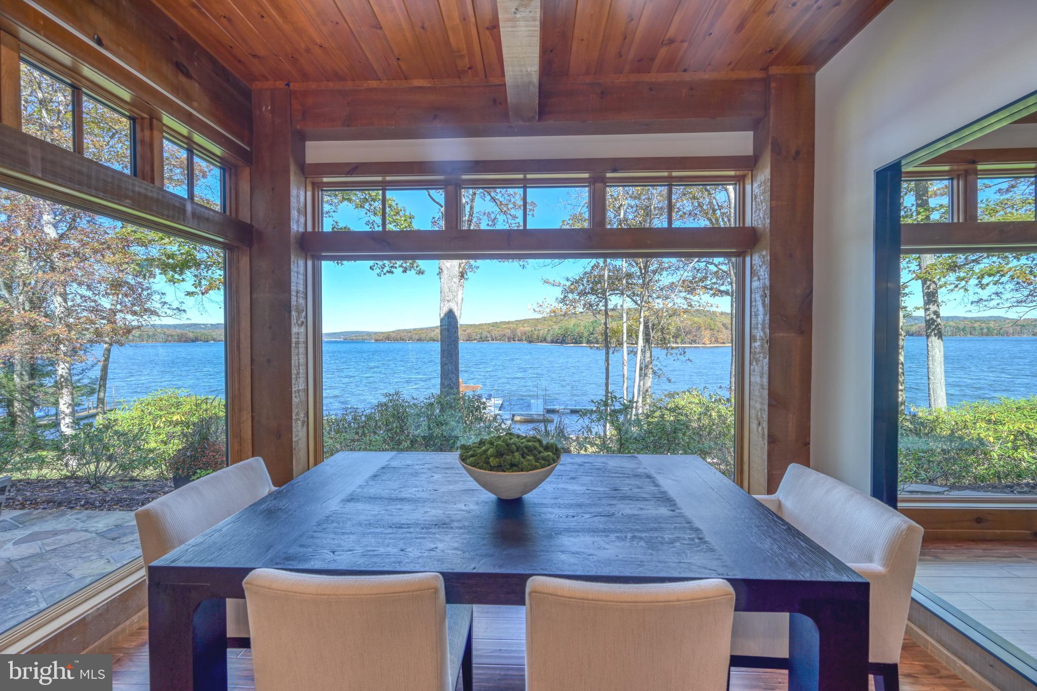 3135 Turkey Neck Road Swanton, MD 21561 - Photo 18 of 74 a view of a dining room with furniture window and outside view