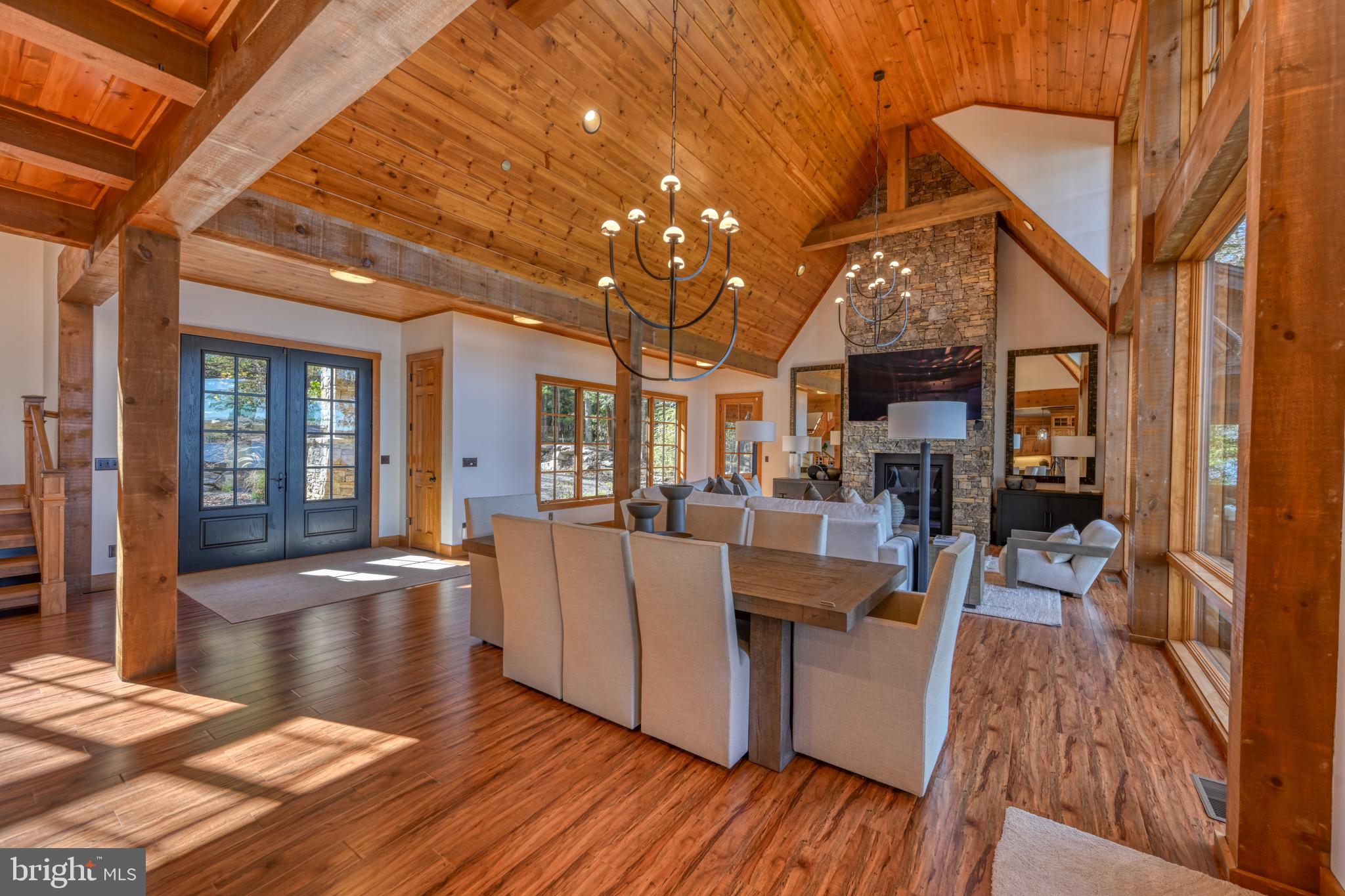 3135 Turkey Neck Road Swanton, MD 21561 - Photo 19 of 74 a living room with furniture a wooden floor and next to a large window