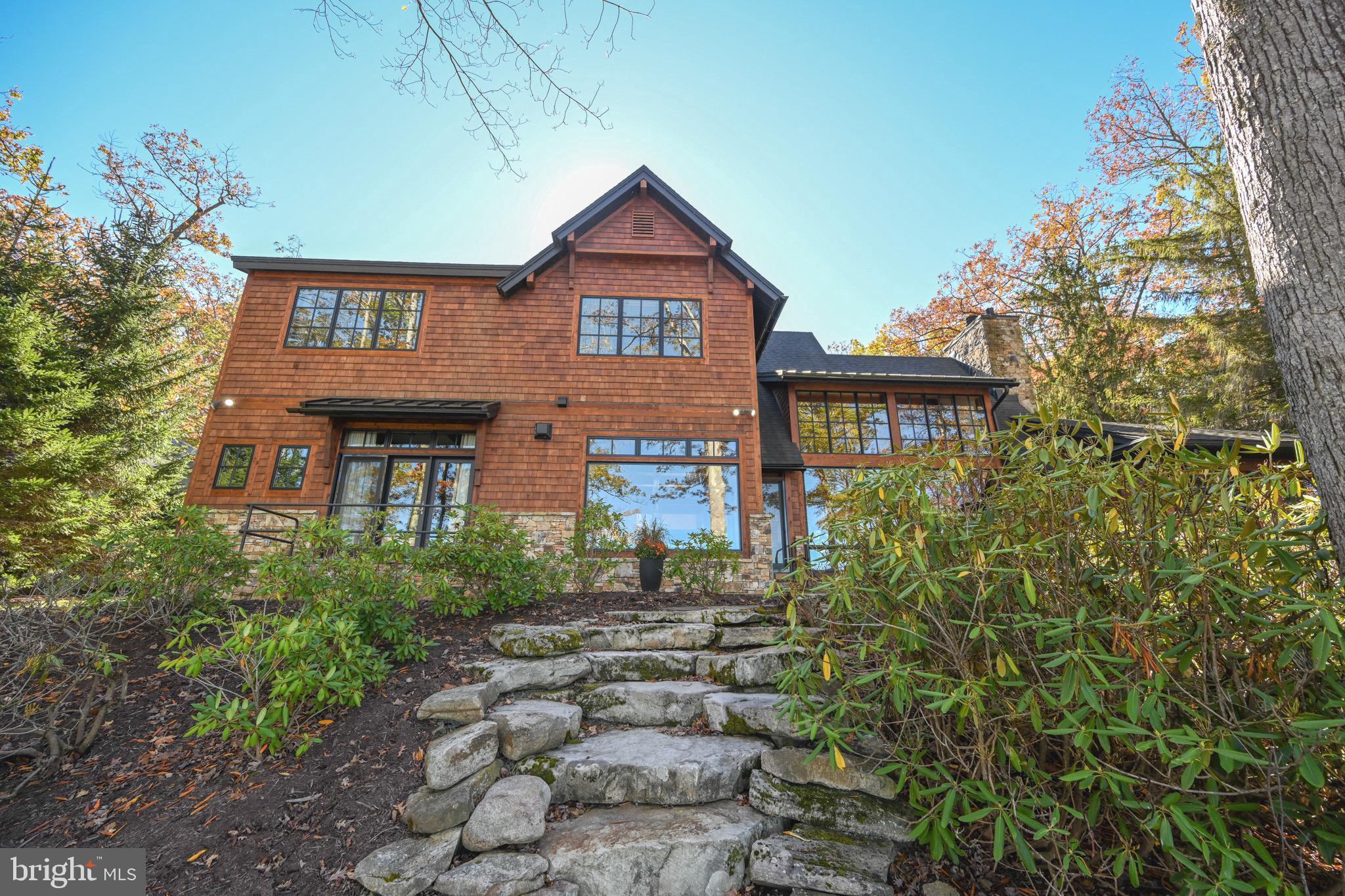 3135 Turkey Neck Road Swanton, MD 21561 - Photo 2 of 74 a front view of a house with garden