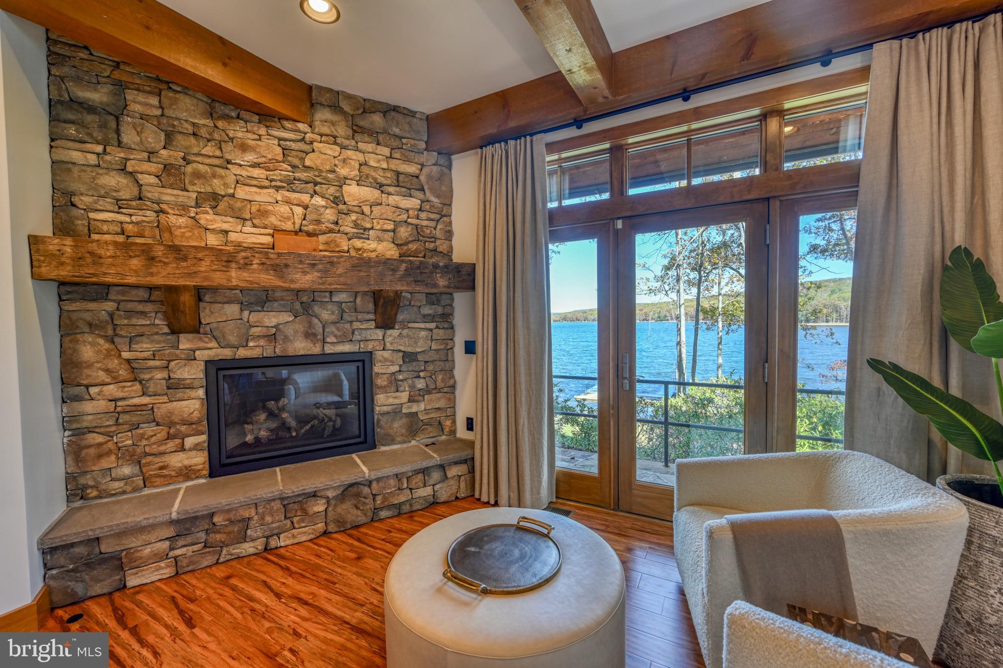 3135 Turkey Neck Road Swanton, MD 21561 - Photo 26 of 74 a living room with furniture and a fireplace