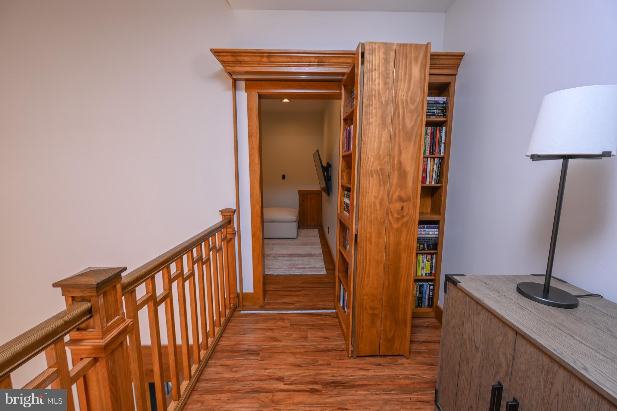 3135 Turkey Neck Road Swanton, MD 21561 - Photo 31 of 74 a view of a hallway with wooden floor and stairs