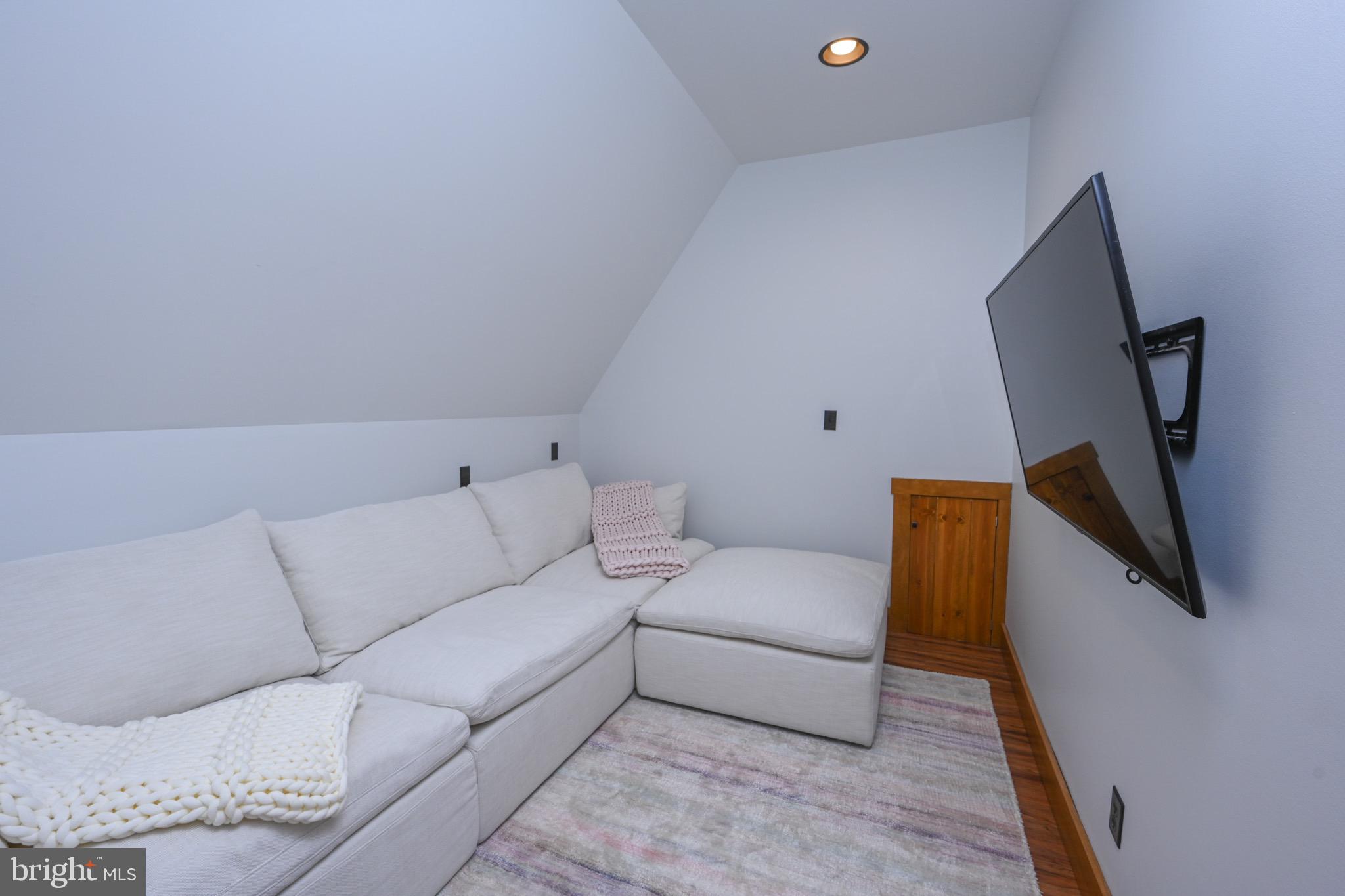 3135 Turkey Neck Road Swanton, MD 21561 - Photo 32 of 74 a living room with furniture and a flat screen tv