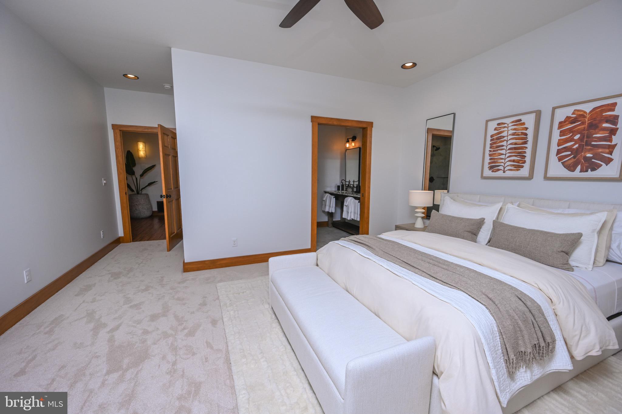 3135 Turkey Neck Road Swanton, MD 21561 - Photo 34 of 74 a bedroom with a bed and a chandelier