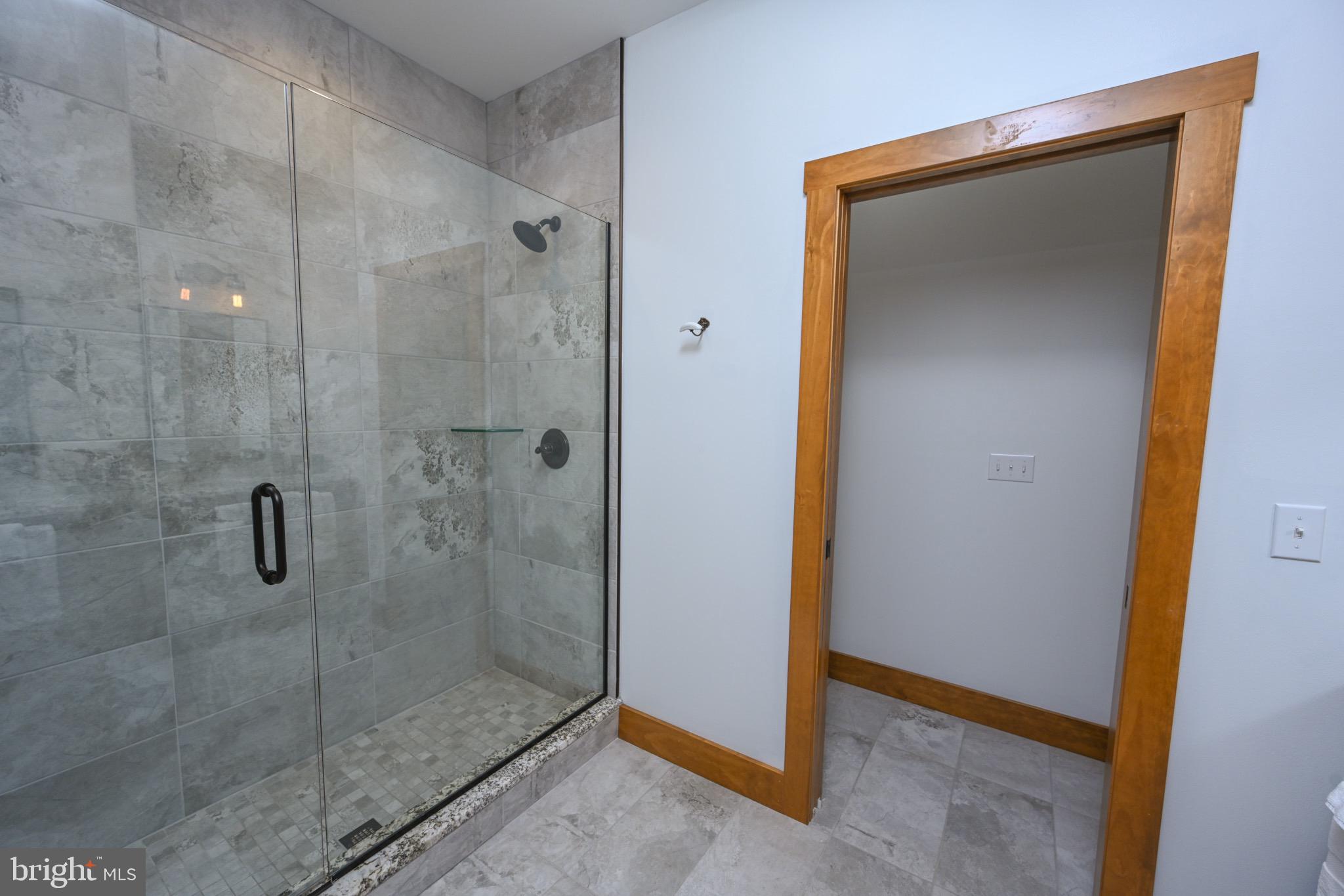 3135 Turkey Neck Road Swanton, MD 21561 - Photo 36 of 74 a bathroom with a glass shower door