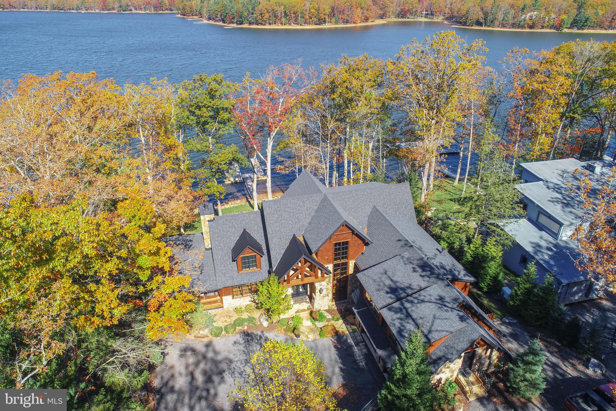 3135 Turkey Neck Road Swanton, MD 21561 - Photo 4 of 74 an aerial view of a house with a yard and lake view