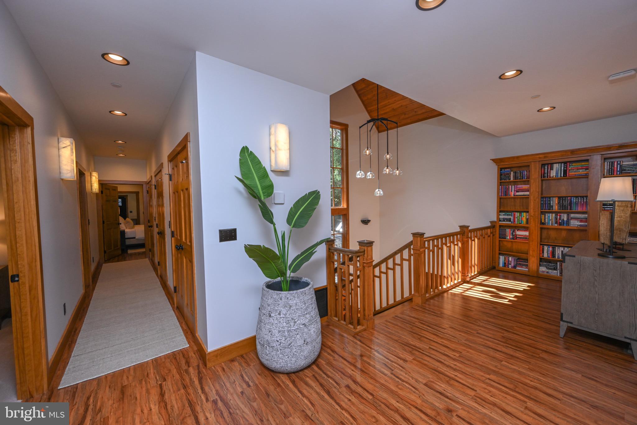 3135 Turkey Neck Road Swanton, MD 21561 - Photo 41 of 74 a hallway with wooden floor and dining area