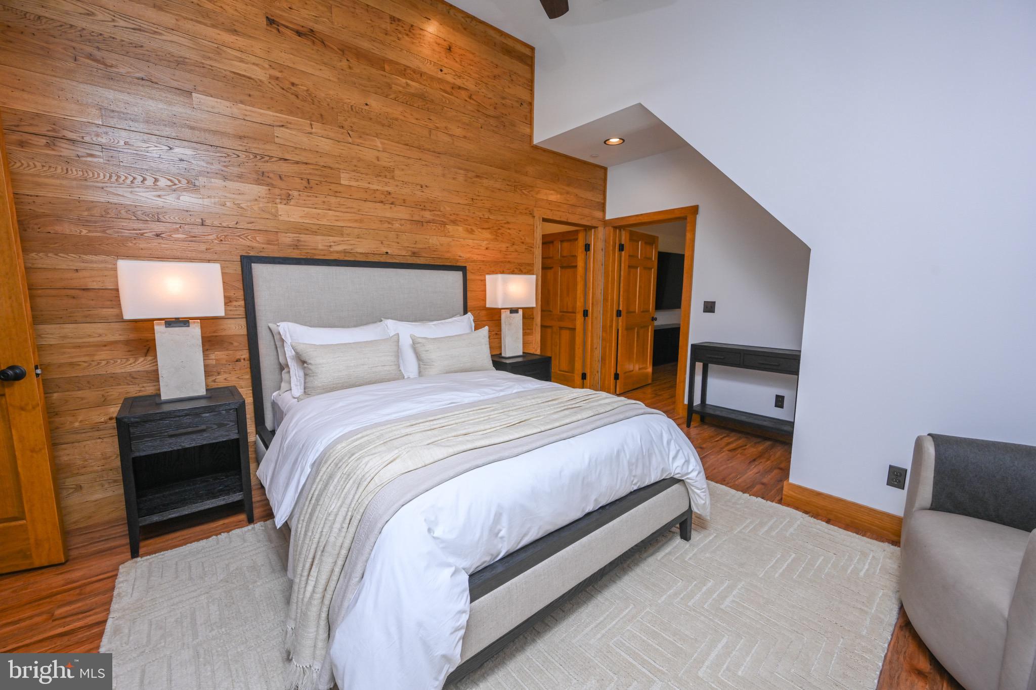 3135 Turkey Neck Road Swanton, MD 21561 - Photo 50 of 74 a bedroom with a bed and a lamp