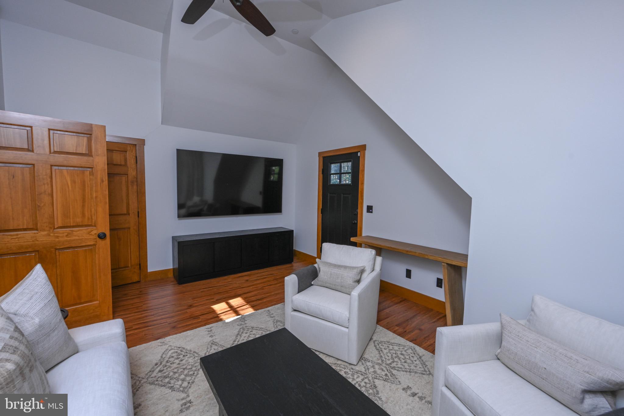 3135 Turkey Neck Road Swanton, MD 21561 - Photo 54 of 74 a living room with furniture and a flat screen tv