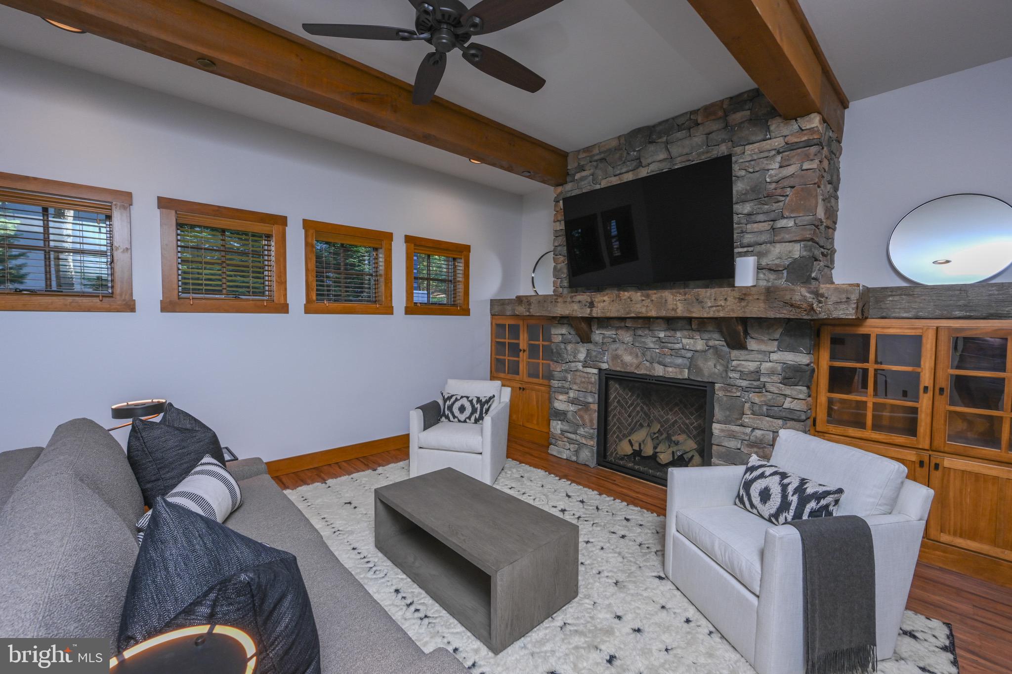 3135 Turkey Neck Road Swanton, MD 21561 - Photo 58 of 74 a living room with furniture and a fireplace