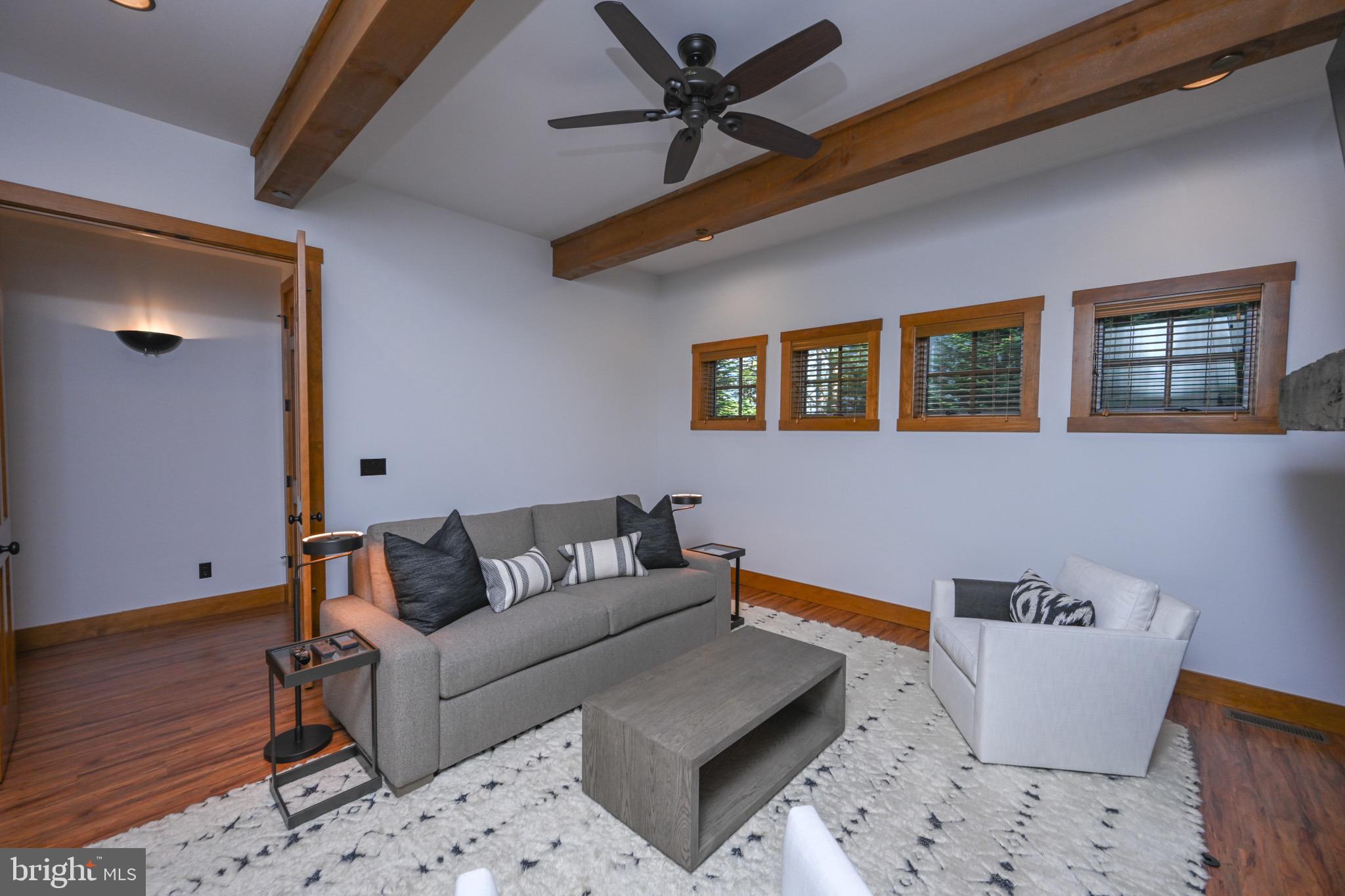 3135 Turkey Neck Road Swanton, MD 21561 - Photo 59 of 74 a living room with furniture and a wooden floor