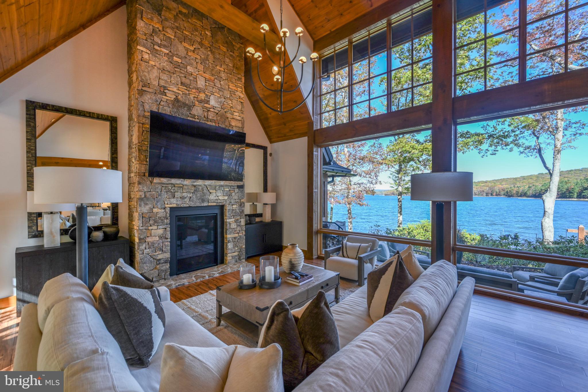 3135 Turkey Neck Road Swanton, MD 21561 - Photo 9 of 74 a living room with fireplace furniture and a flat screen tv